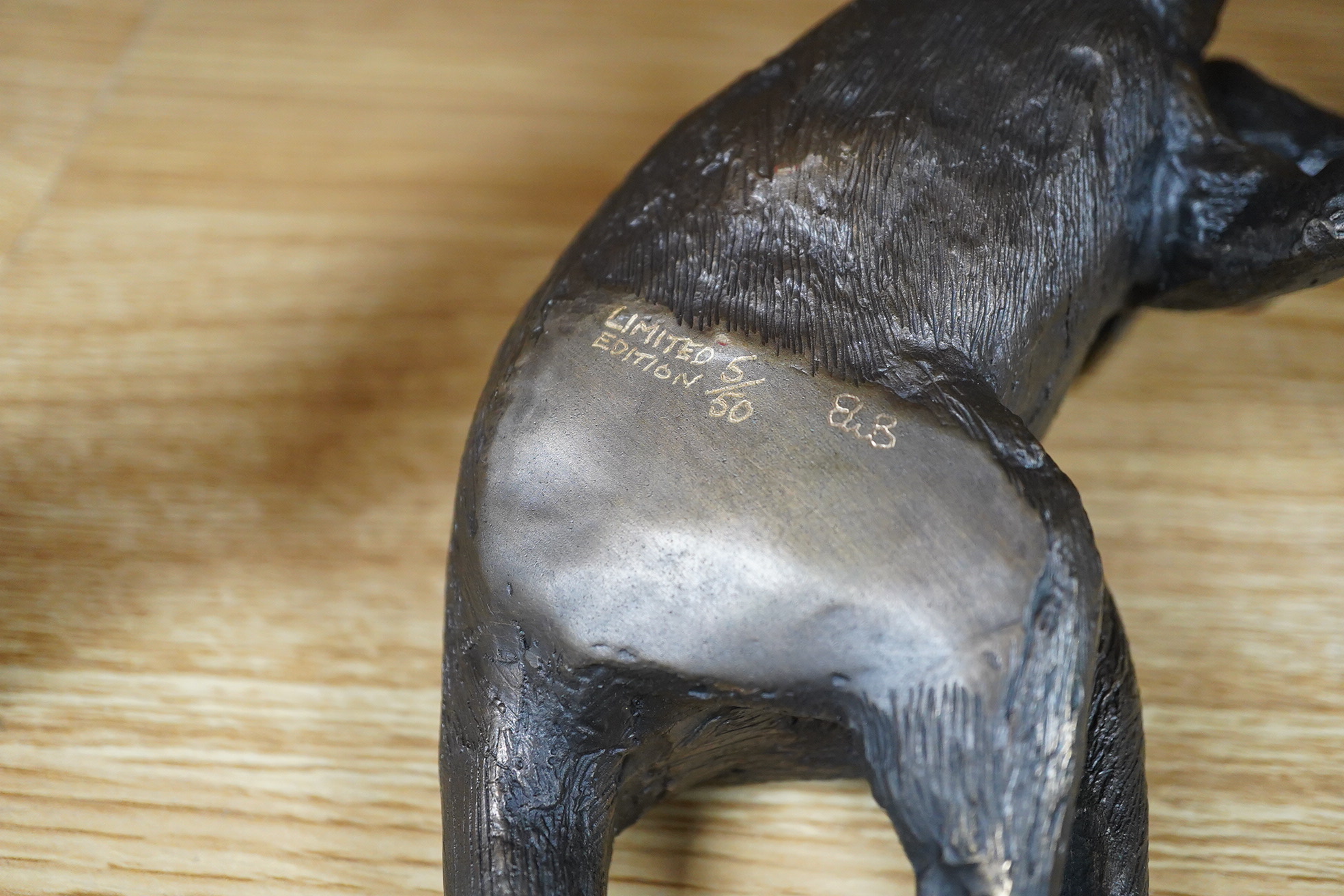 A late 20th century Australian partially gilt bronze model of a recumbent kangaroo, limited edition 5/50, 26cm wide